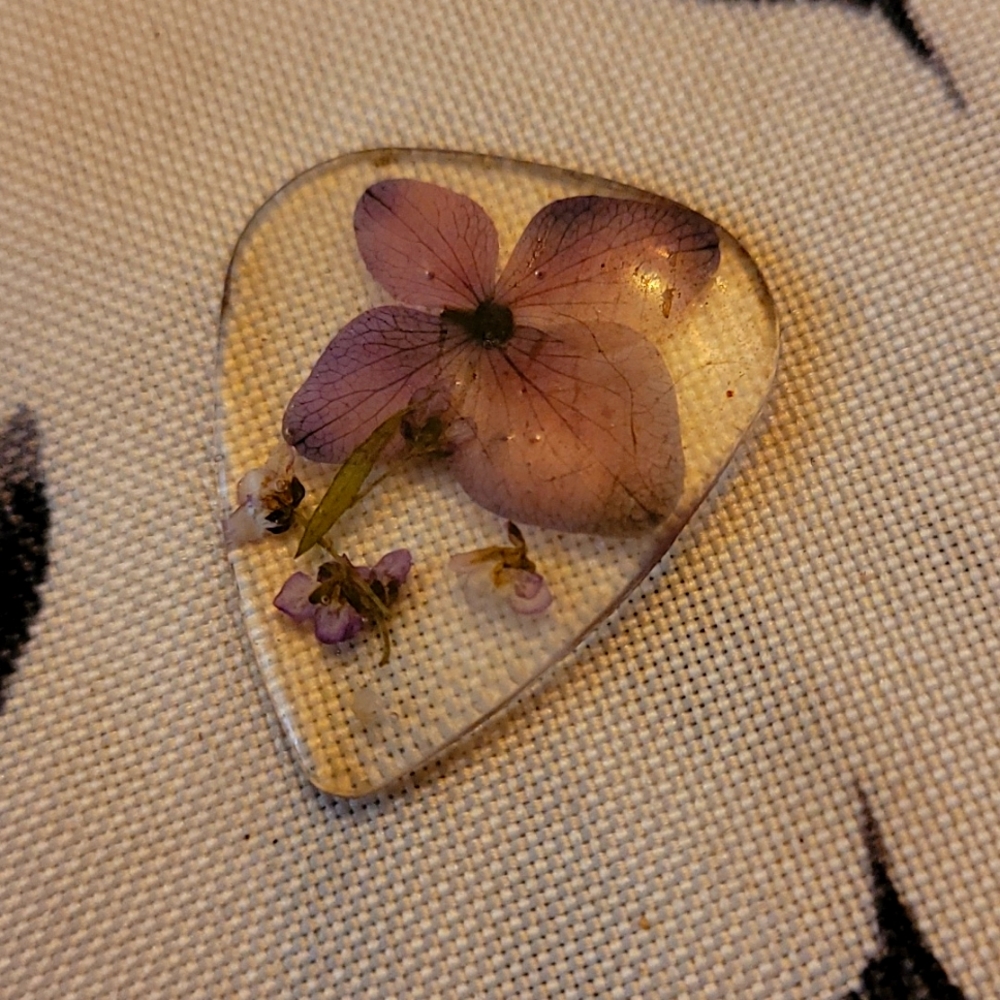Pressed flower resin guitar pick